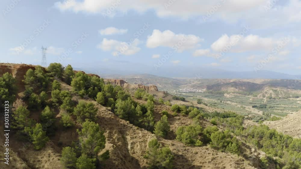 Aerial Drone view of Mirador del fin del mundo in Blue sky, Sierra Nevada, Granada, Spain. Dry