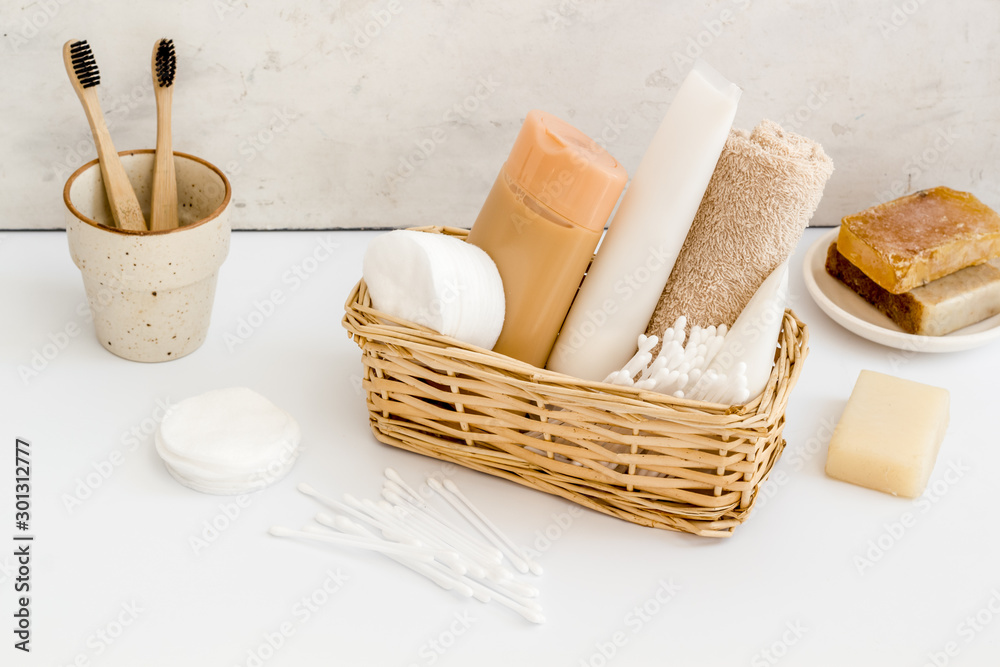 Bathroom accessories set with tooth brushes and towels on white background