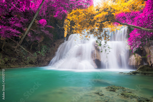 Amazing in nature  beautiful waterfall at colorful autumn forest in fall season 