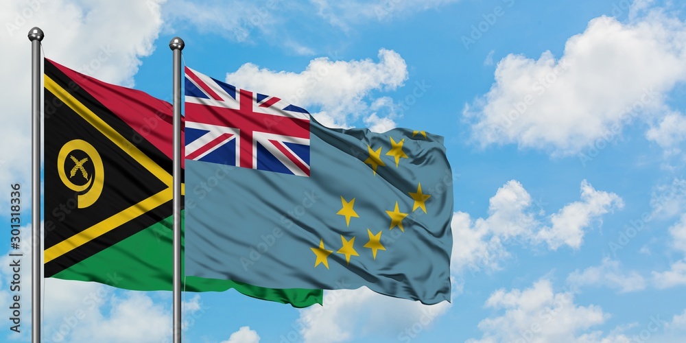 Vanuatu and Tuvalu flag waving in the wind against white cloudy blue sky together. Diplomacy concept, international relations.