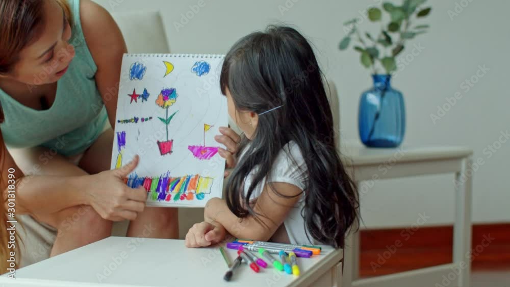 Little girl clapping hands with happily and mother appreciate her Little girl clapping hands with happily and mother appreciate her