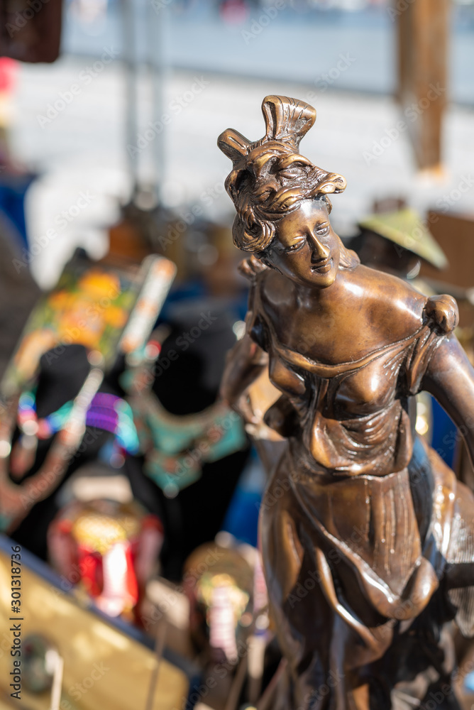 Bronze statuette of woman at flea market
