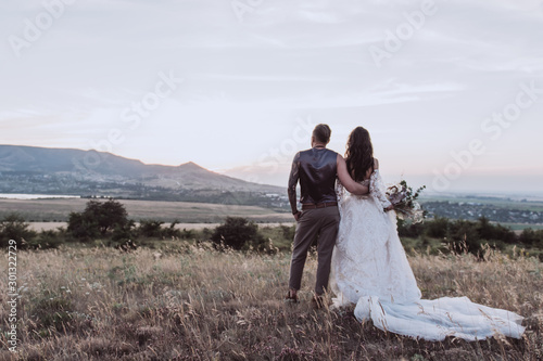 guy and girl in vintage style wedding landscape mountains