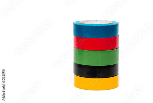 Rolls of insulation adhesive tape, multi colored ribbons on a white background. Bright and colorful insulation tape