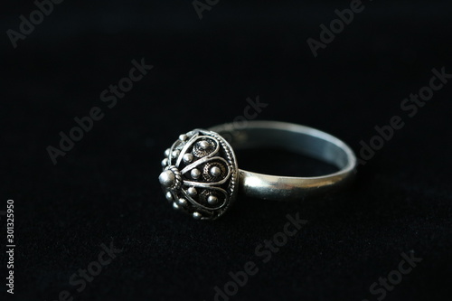 traditional authentic Shibenik silver ring on black background. Shibenik button. Croatian vintage jewelry photo