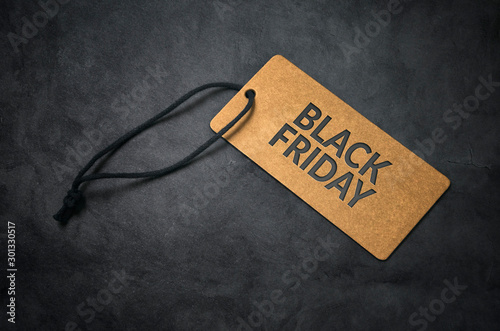 Black Friday. Golden sale tag on black background.