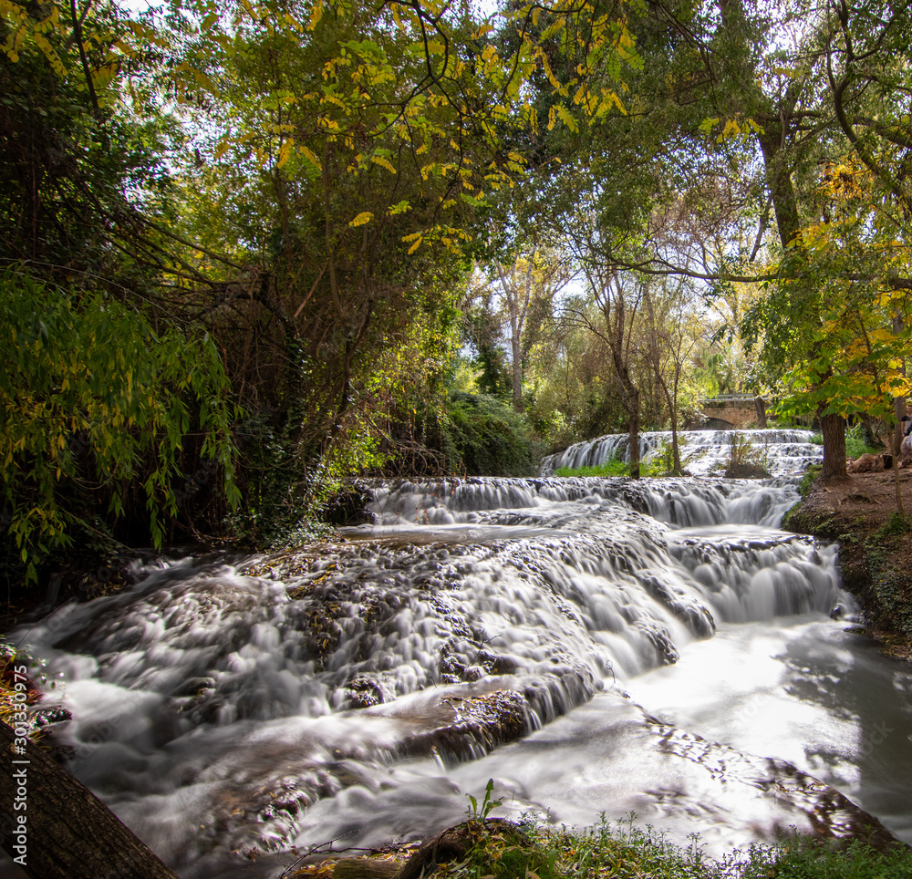 river with waterfall in the autumn season river with waterfall in the autumn season