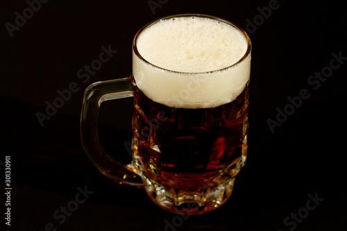 glass of beer isolated on black background