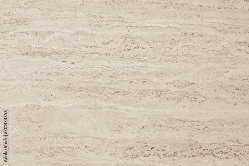 Marble limestone texture background in beige brown cream sepia color photo