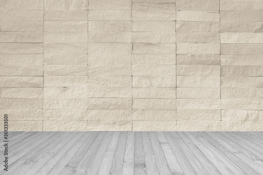 Fototapeta premium Rock tile wall in light cream beige brown color with wooden floor in dark grey