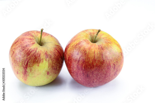 yellow and red apple on a white background