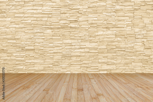 Limestone rock tile wall backdrop in yellow cream brown color tone with wooden floor in light yellow brown