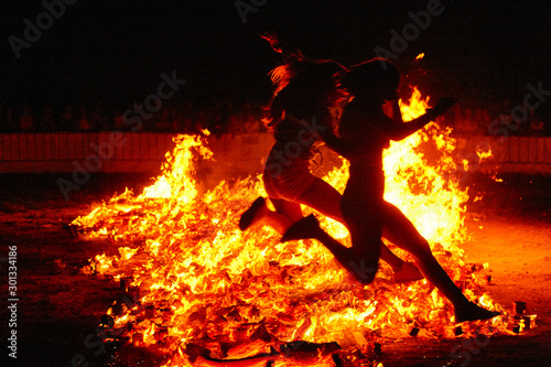 Summer solstice celebration in Spain. People jumping into the fire.
