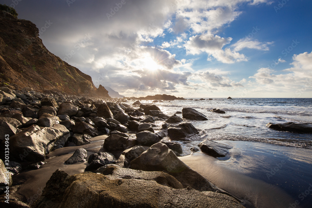 Coast of Tenerife with black sand and huge stones Coast of Tenerife with black sand and huge stones