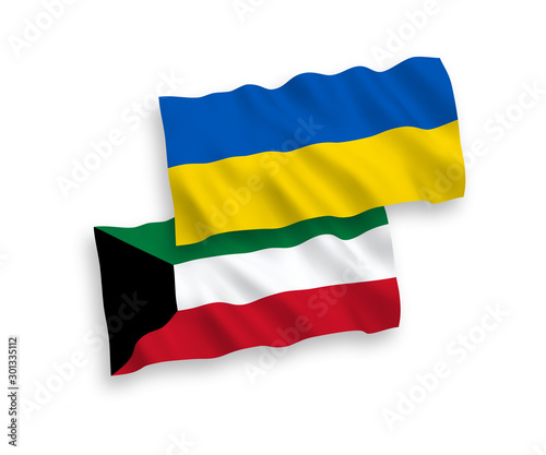 National vector fabric wave flags of Kuwait and Ukraine isolated on white background. 1 to 2 proportion.