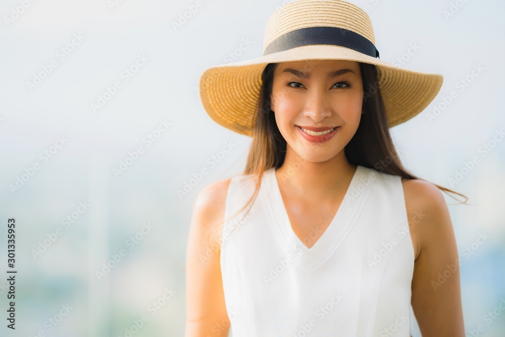 Portrait beautiful young asian woman happy smile relax on the roof top bar