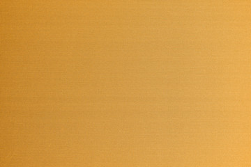 Cotton silk fabric wallpaper texture pattern background in yellow orange copper gold brass brown color tone