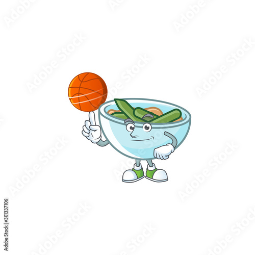 Green beans casserole in bowl holding basketball mascot.