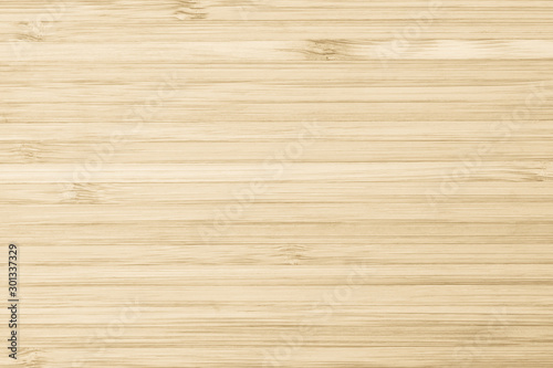 Bamboo wood texture background in natural light yellow brown color .
