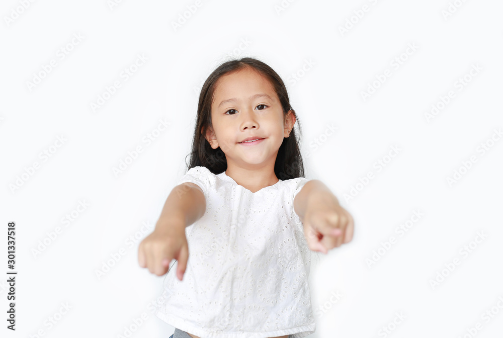 Cheerful little Asian girl child pointing at you and looking camera isolated over white background. Kid point to front. Cheerful little Asian girl child pointing at you and looking camera isolated over white background. Kid point to front.