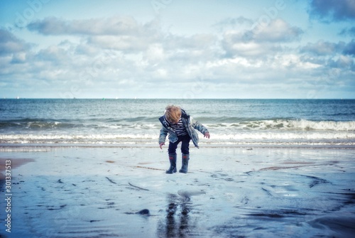 Boy jumping on the beach