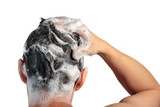 Male hand washes his head with shampoo and foam on a white background, back view