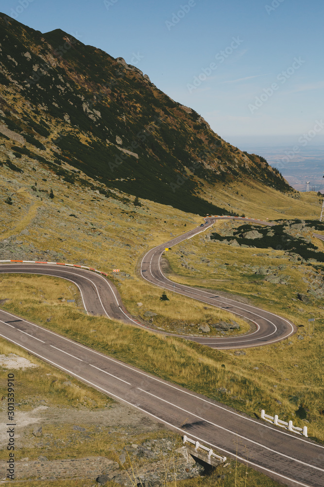A spring landscape of mountains and the road with 10 kilometers curves