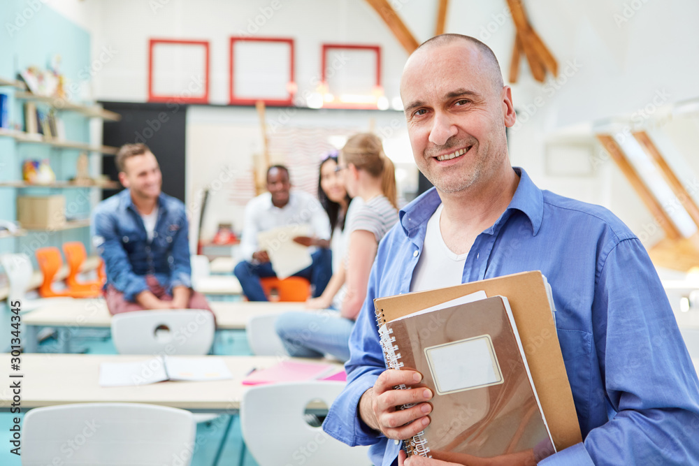 Smiling man as a lecturer with documents Smiling man as a lecturer with documents