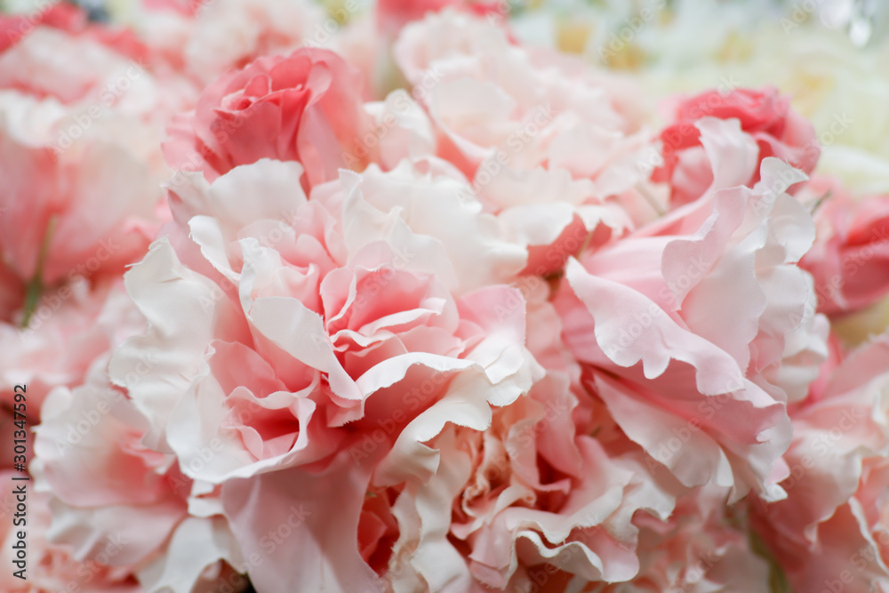 Fototapeta premium Pastel artificial rose and carnation flowers for background