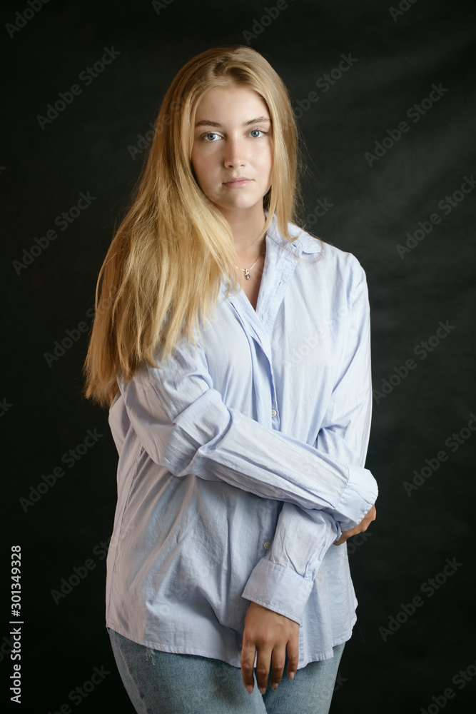 Portrait of beautiful sensual woman with blue eyes. Studio shot. Portrait of beautiful sensual woman with blue eyes. Studio shot.