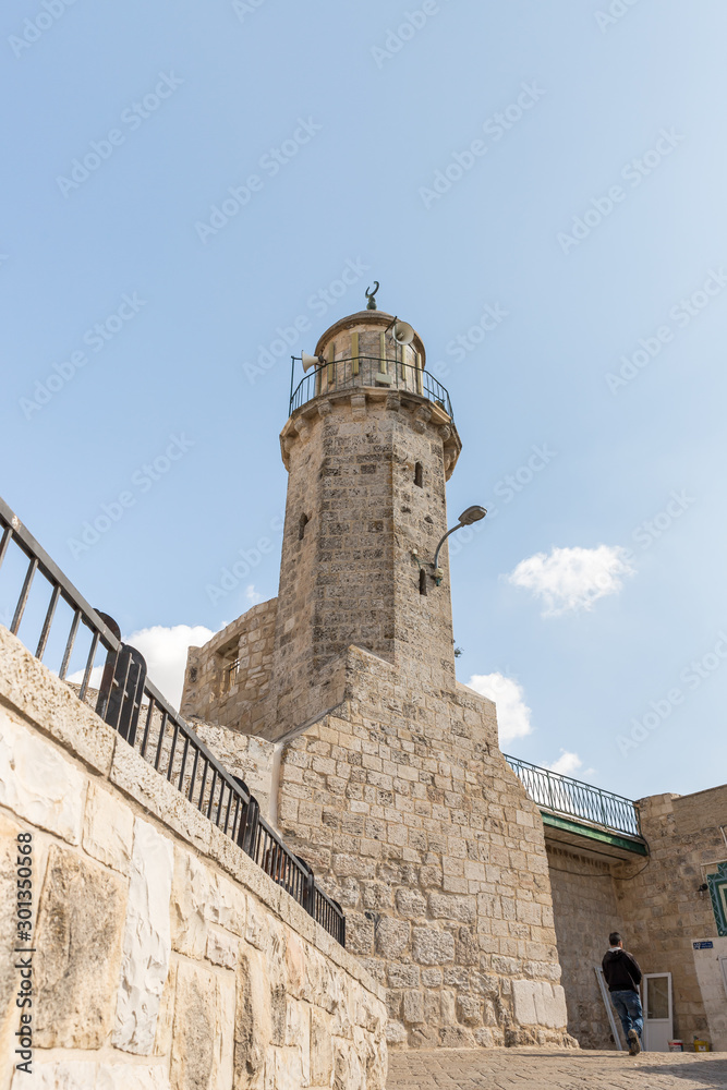 The minaret rises above the entrance to the courtyard of the Chapel of the Ascension on Mount Eleon - Mount of Olives in East Jerusalem in Israel