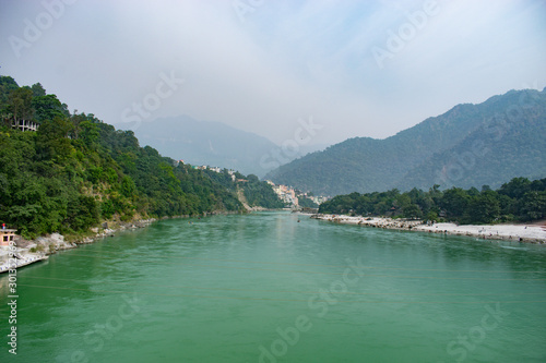 beautiful green water of River Ganges flowing in the mountains of Rishikesh (Yoga capital of the world)in India - Asia travel destination  beautiful view of lake with blue water 