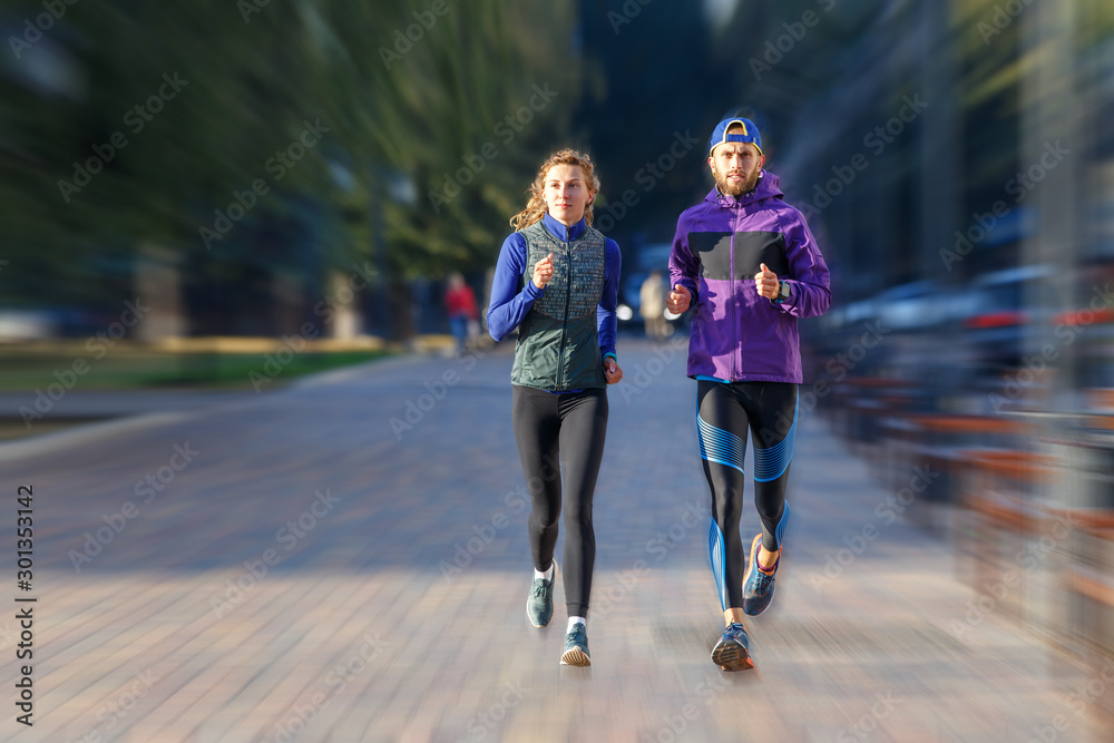 Concept image of fast running couple on the street Concept image of fast running couple on the street