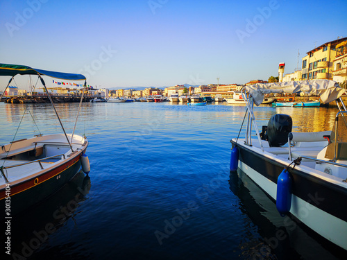 Port of Castellammare di Stabia, with a view of boats and the buildings of the waterfront, taken on a summer day