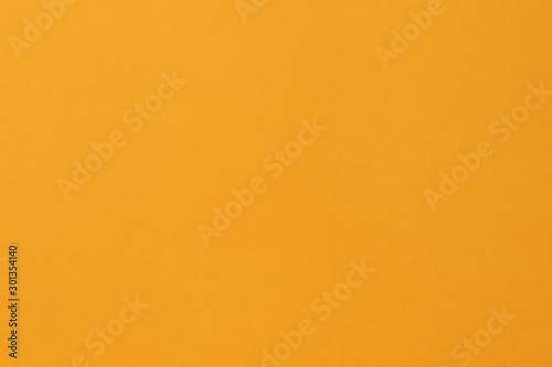 Empty orange paper backgrounds. Clean yellow texture with simple surface. High resolution. Color saffron yellow paper.