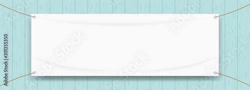 vinyl banner blank white isolated on wood blue pastel color, white mock up textile fabric empty for banner advertising stand hanging, indoor outdoor fabric mesh vinyl backdrop for presentation frame