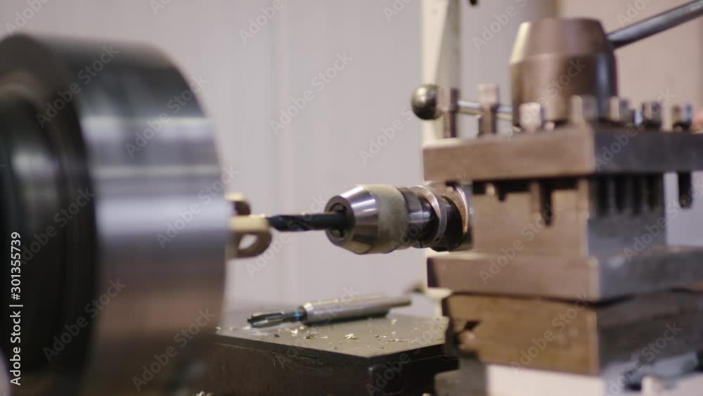 man operating a steel drilling machine 4k ProRes Footage