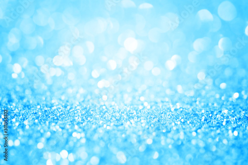 Blue glitter abstract background with bokeh defocused. Macro shot.
