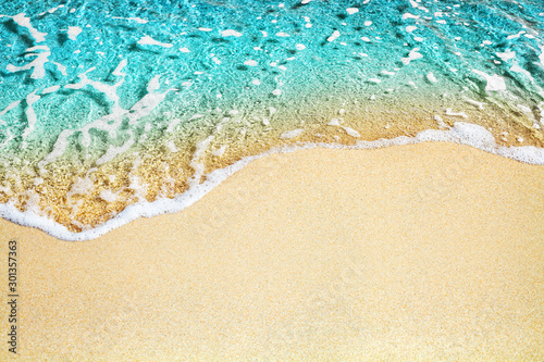 Wallpaper Mural Blue sea wave, white foam, golden sand beach, turquoise ocean water close up, su