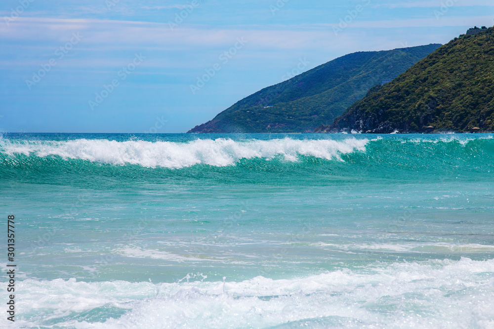 Blue Sea Wave with White Foam and Sky Blue Sea Wave with White Foam and Sky