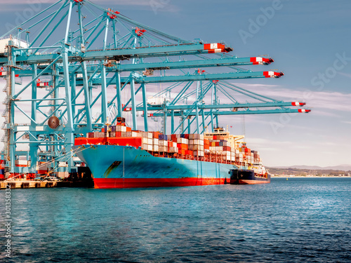 Container ship in the habor of Algeciras, Spain, loading and unloading containers