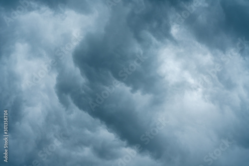 Beautiful dramatic sky with thick gray and blue clouds