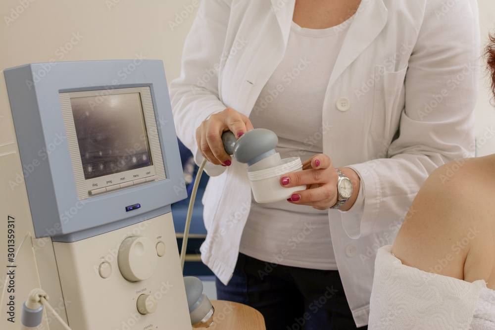 Ultrasound in Physical Therapy. Therapist Using Ultrasound Applicator