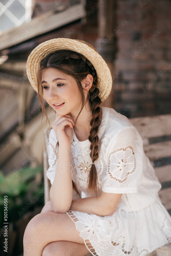 Portrait of beautiful girl with makeup in fashion clothes and hat