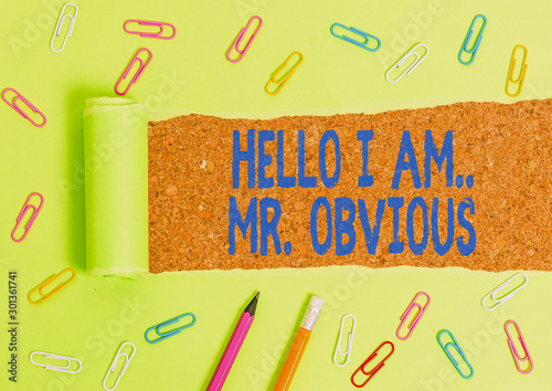 Word writing text Hello I Am Mrobvious. Business photo showcasing introducing yourself as pouplar or famous demonstrating Stationary and torn cardboard placed above a wooden classic table backdrop photo