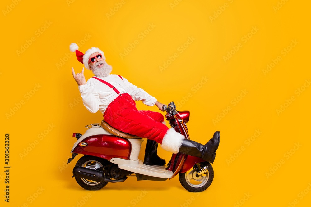 Full body photo of funny white hair santa in festive mood riding x-mas ...