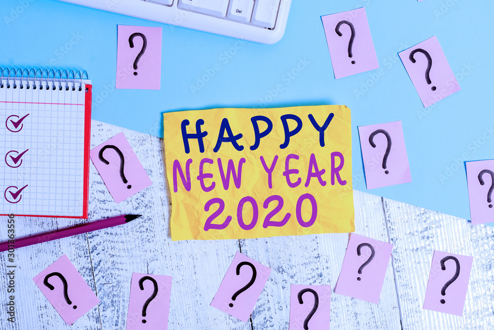 Writing note showing Happy New Year 2020. Business concept for Greeting Celebrating Holiday Fresh Start Best wishes Writing tools and scribbled paper on top of the wooden table Writing note showing Happy New Year 2020. Business concept for Greeting Celebrating Holiday Fresh Start Best wishes Writing tools and scribbled paper on top of the wooden table