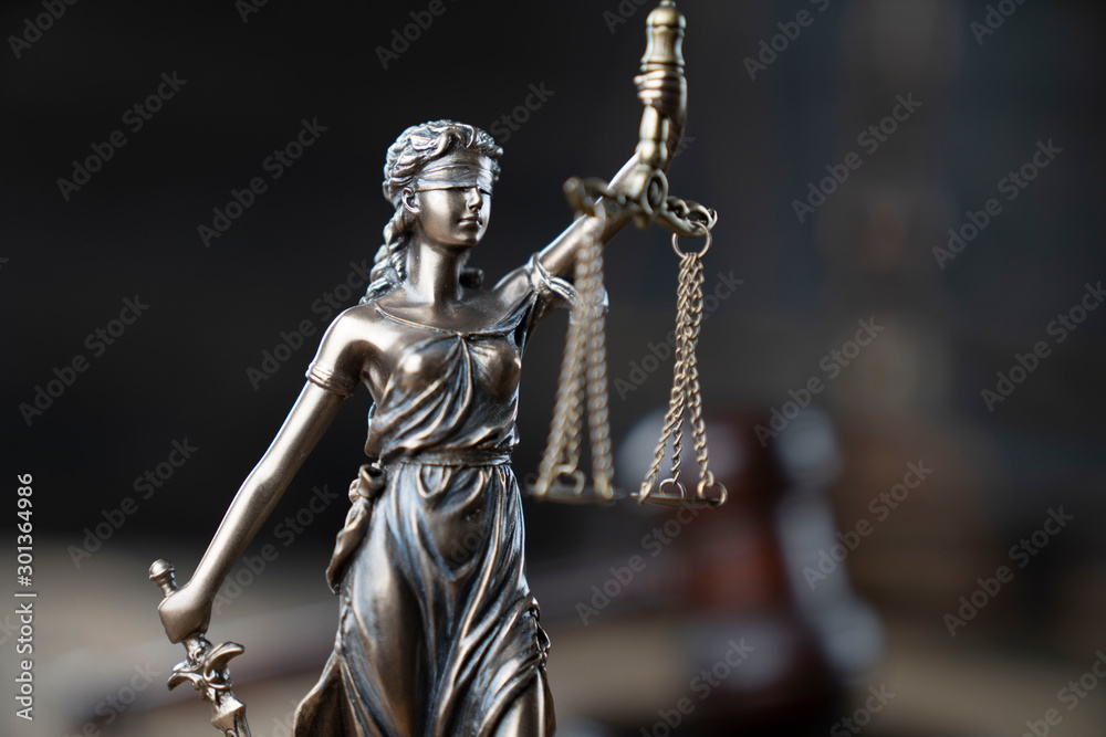 Justice concept. Themis statue and judge's gavel on the dark background. Justice concept. Themis statue and judge's gavel on the dark background.
