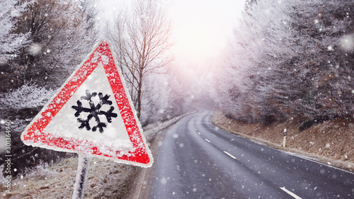 traffic sign, warns of the black ice on the det street in the mountains photo