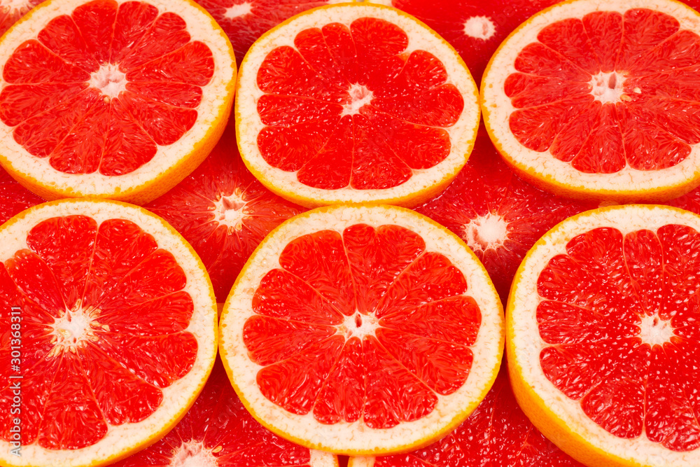 Grapefruit red juicy slices background. top view Grapefruit red juicy slices background. top view